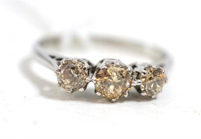 Lot 45 - A diamond three stone ring, stamped '18ct', total estimated diamond weight 0.75 carat approximately