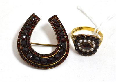 Lot 48 - A garnet and cultured pearl ring and a horseshoe brooch