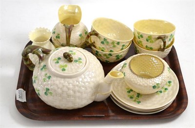 Lot 51 - A Belleek shamrock and basket moulded tea set and a similar vase