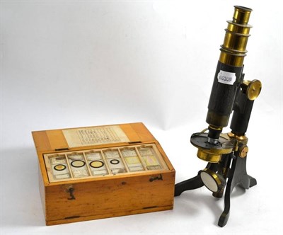 Lot 54 - A microscope and slides