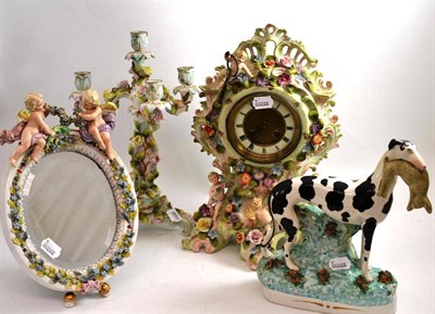 Lot 57 - Late 19th century flower encrusted clock, oval mirror, Staffordshire figure and candelabra