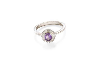 Lot 307 - An 18 Carat White Gold Purple Sapphire and...