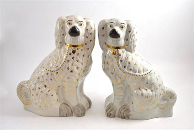 Lot 83 - Pair of Staffordshire spaniels - gilded
