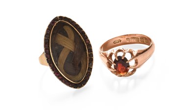 Lot 315 - A 9 Carat Gold Garnet Solitaire Ring, finger...