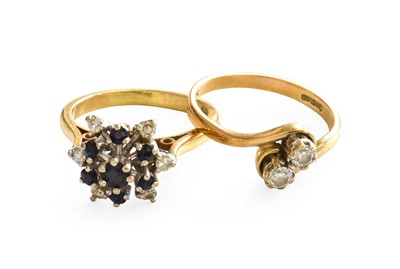 Lot 401 - A 9 Carat Gold Diamond Twist Ring, finger size...