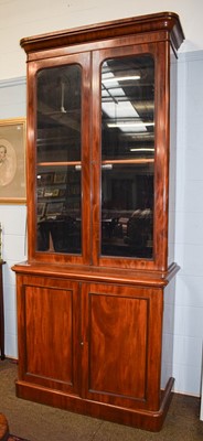 Lot 1493 - A 19th-Century Mahogany Bookcase, the upper...