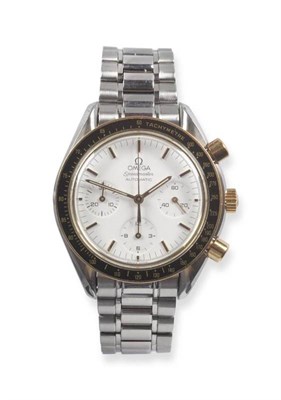 Lot 326 - A Steel and Gold Automatic Chronograph Wristwatch, signed Omega, model: Speedmaster, circa...