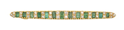 Lot 2147 - An Emerald and Diamond Brooch the tapered bar...