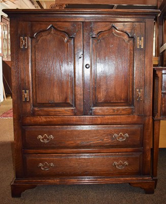 Lot 1397 - A Titchmarsh & Goodwin Style Oak Cabinet, two...