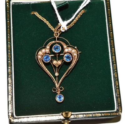 Lot 123 - A sapphire and seed pearl brooch/pendant on a chain