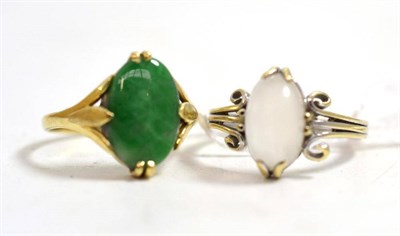Lot 130 - Two rings, including an oval cabochon moonstone in a white scrolling mount, and an oval...