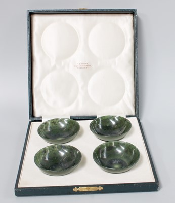 Lot 184 - A Cased Set of Four Chinese Spinach Jade Bowls,...