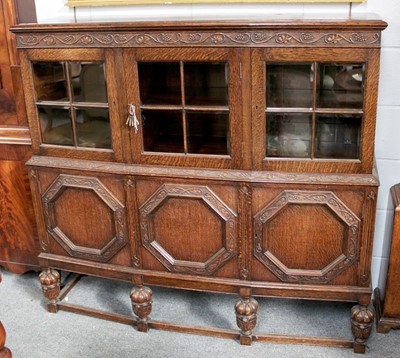 Lot 1321 - An Oak Cabinet, with three glazed cupboard...