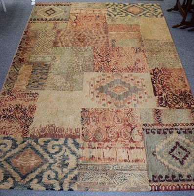 Lot 1261 - A Machine Made Patchwork Carpet, of varying...