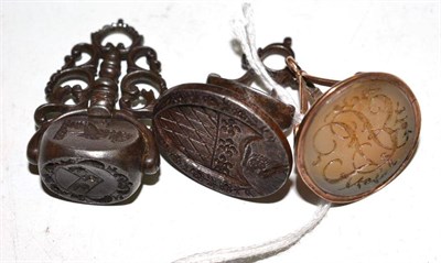 Lot 161 - Two cut steel seal fobs, one with a revolving three section matrix with locking mechanism and a...