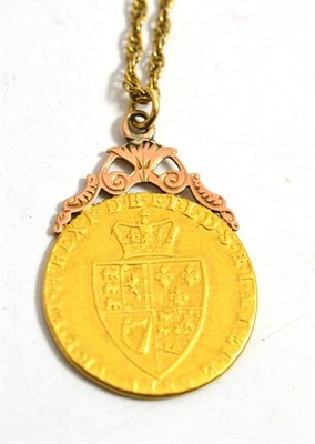 Lot 162 - A spade guinea soldered as a pendant, on a fancy link chain