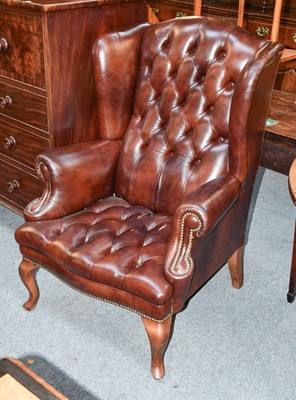 Lot 1451 - Canella: A Reproduction Wing-Back Chair,...