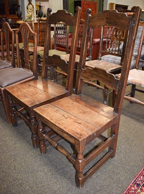 Lot 1452 - A Pair of Late 17th century Oak Hall Chairs,...