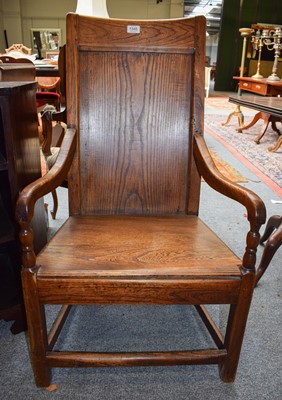 Lot 1345 - An 18th Century Elm Panel Back Armchair