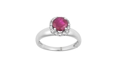 Lot 2066 - A Ruby and Diamond Cluster Ring the round cut...