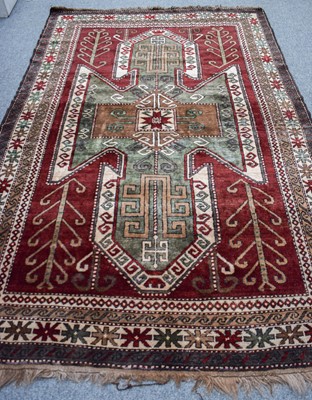 Lot 1266 - A Kars Kazakh Rug, the aubergine field of...