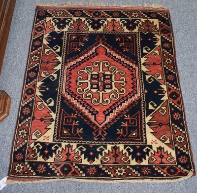 Lot 1265 - A Melas Prayer Rug, the walnut field with...