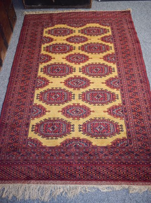 Lot 1264 - "Bukhara" Rug, the mustard ground Salor guls...