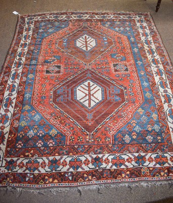 Lot 1279 - An Afshar Rug, the terracotta field with two...