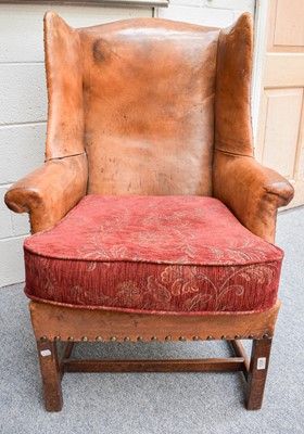 Lot 1335 - A George III Style Wing Back Armchair,...