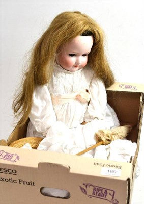 Lot 189 - An Armand Marseille bisque socket head 390 girl doll with two garments and straw bonnet (eyes...