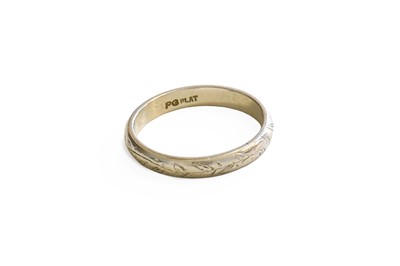 Lot 289 - A Textured Band Ring, the band stamped 'PG'...