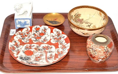Lot 193 - A Hirado porcelain figure of a dog, a Satsuma bowl, a Kutani plate, pottery bowl and a lacquer dish