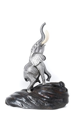 Lot 2141 - A Zimbabwean Silver Model of a Bull Elephant Reaching