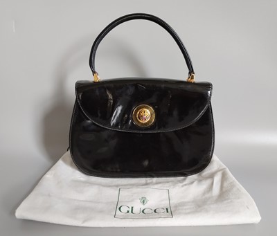 Lot 1016 - Circa 1980s Gucci Black Patent Handbag, with...