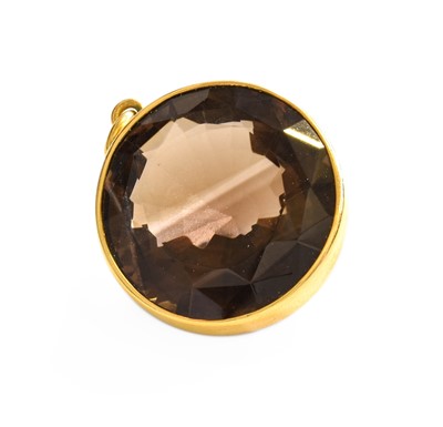 Lot 329 - A Smoky Quartz Pendant, the round cut smoky...