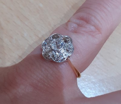 Lot 2040 - A Diamond Cluster Ring the central raised old...