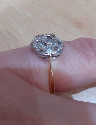 Lot 2040 - A Diamond Cluster Ring the central raised old...