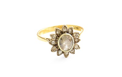 Lot 365 - A Diamond Cluster Ring, the oval cut diamond...