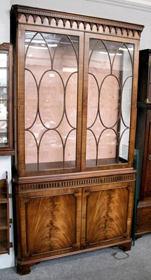 Lot 1127 - A Mahogany Bookcase, 20th century, the glazed...