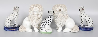 Lot 127 - ~ A Pair of Staffordshire Seated Poodles, with...