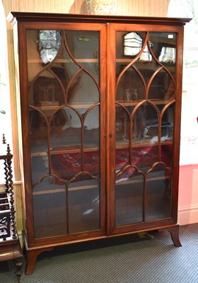 Lot 1348 - A George III Glazed Mahogany Bookcase, raised...