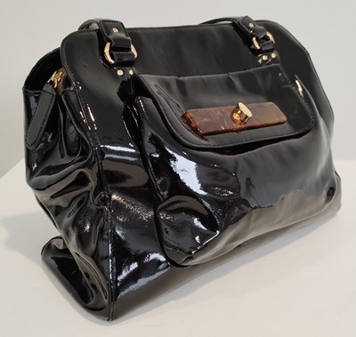 Lot 1048 - Orla Kiely Black Patent Shoulder Bag, with...