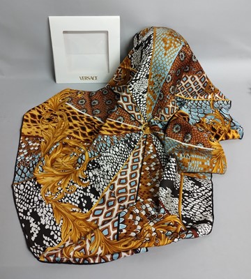 Lot 1052 - Versace Gold, Cream and Blue Silk Scarf,...