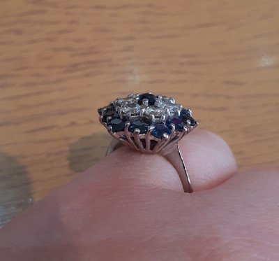 Lot 2088 - A Sapphire and Diamond Cluster Ring the round...
