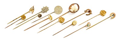 Lot 407 - Thirteen Stickpins, including a diamond...