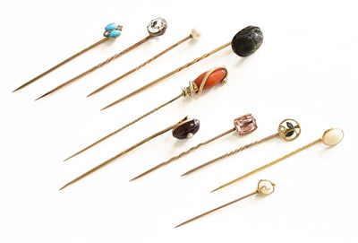 Lot 404 - Ten Stickpins, including a coral and turquoise...