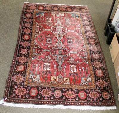 Lot 1230 - Saroukh Rug, the faded raspberry stepped...