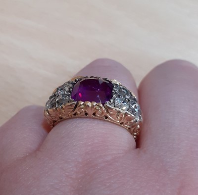 Lot 2300 - A Pinkish-Purple Sapphire and Diamond Ring the...