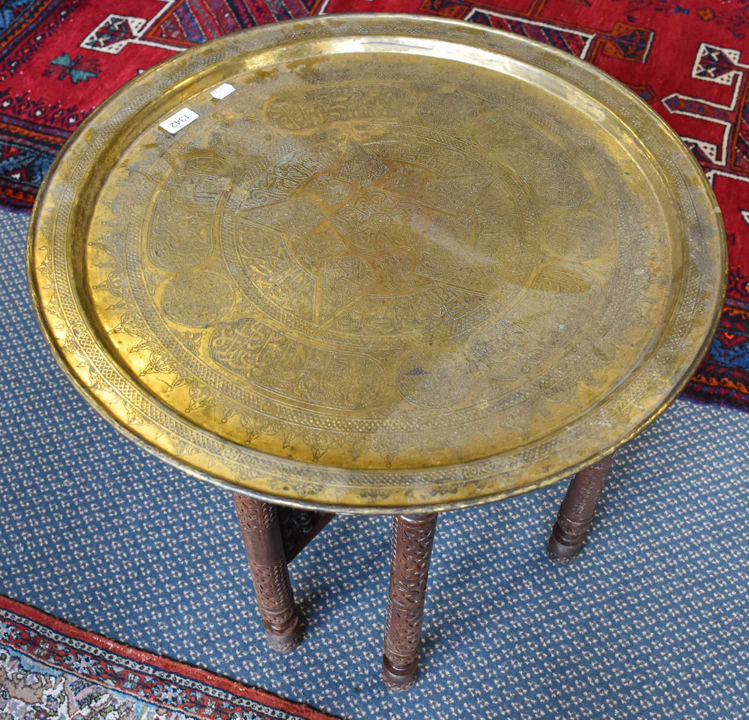 Lot 1342 - A Islamic Brass Top Folding Tea Table,...