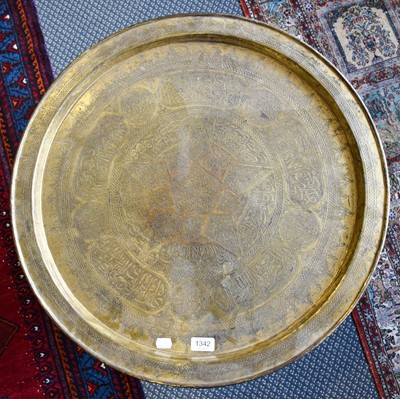 Lot 1342 - A Islamic Brass Top Folding Tea Table,...